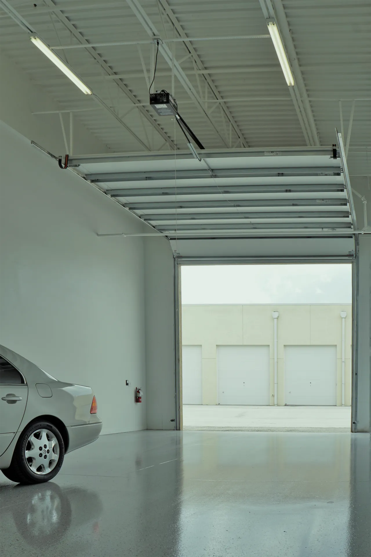 Lift storing multiple cars inside a Vehicle Fortress unit